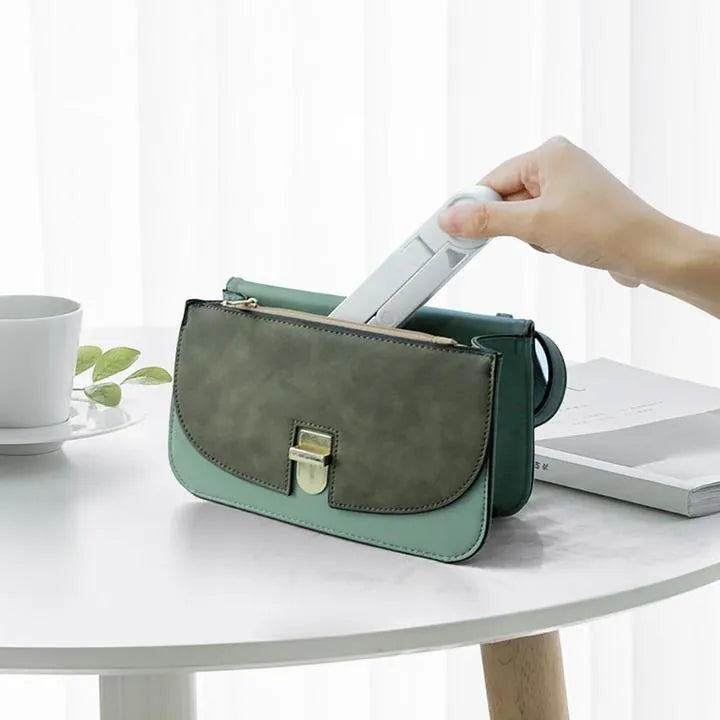 Black foldable tablet holder showing unfolded stand position with device placement area
