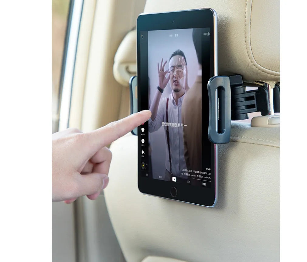 Black car headrest-mounted phone and tablet holder with universal snap-in silicone cradle.