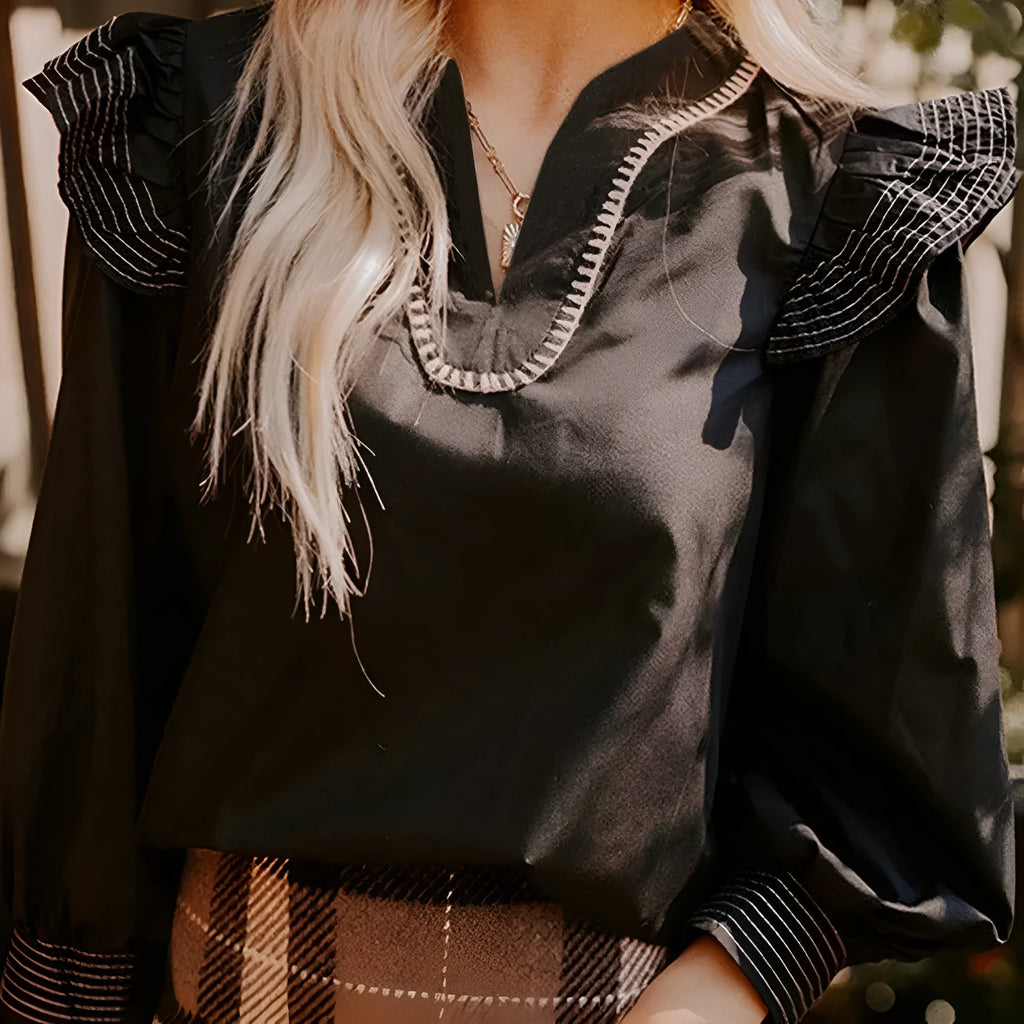 Black women's V-neck blouse with contrast stitching and ruffle long sleeves