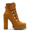 Women's suede ankle boots with a thick high heel and platform sole in four colour choices.