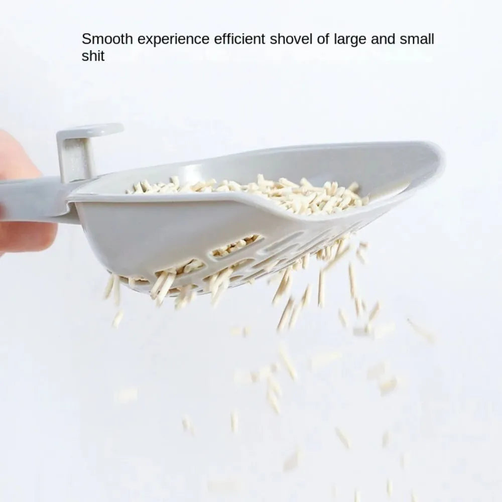 Grey plastic cat litter scoop with an attached stand or base.