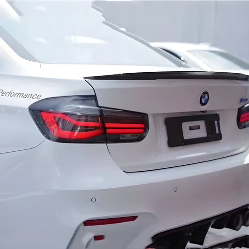 BMW 3 Series modified tail light assembly with streamer steering LED running light in red or smoked black finish