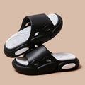 Women's and men's two-colour thick-soled EVA slippers with leather lining on a beach