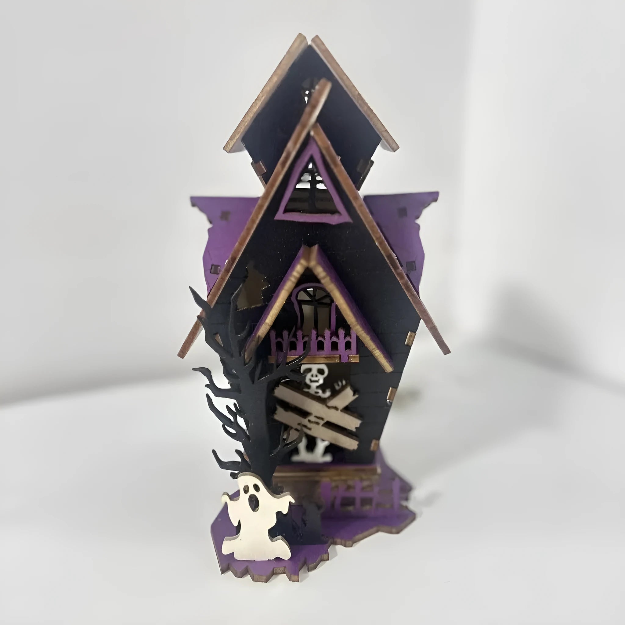 Wooden Halloween haunted house table decoration with luminous finish measuring 14x10.5x19cm