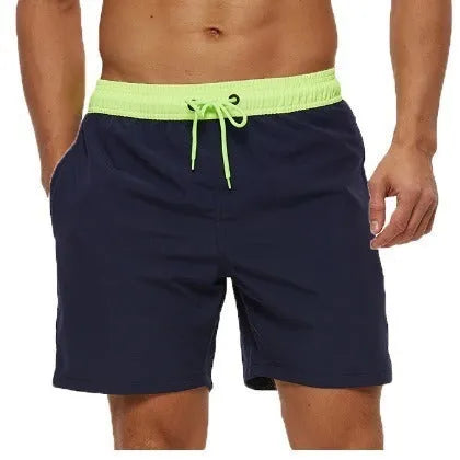 Men's blue training shorts with stitching waist detail and headband pocket for running and fitness