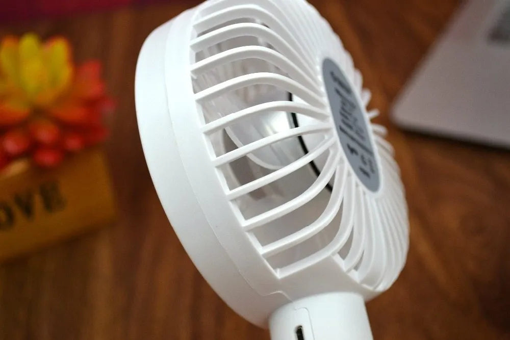 White ORICO FH1 portable USB desk fan with rechargeable battery on a desk