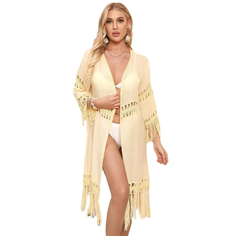 Hand-crocheted acrylic beach cover-up cardigan with tassel detailing in solid colour