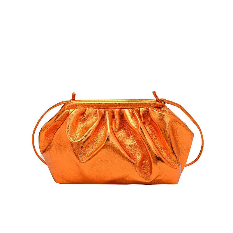 Simple hair clip shoulder crossbody bag in shell shape with sewing line details, shown in rose red colour.
