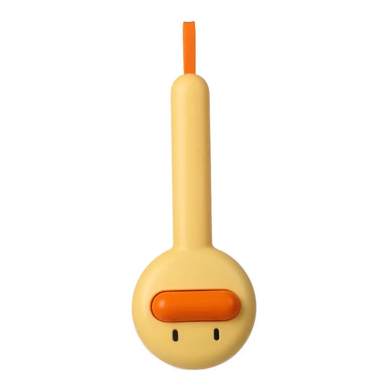 Small yellow duck-shaped pet grooming comb with open section and floating needles