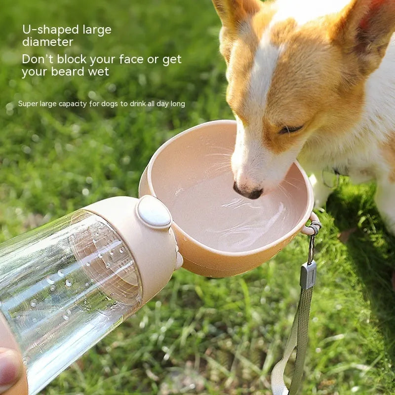 Portable dog water bottle with integrated food container in brown, pink, or yellow colours