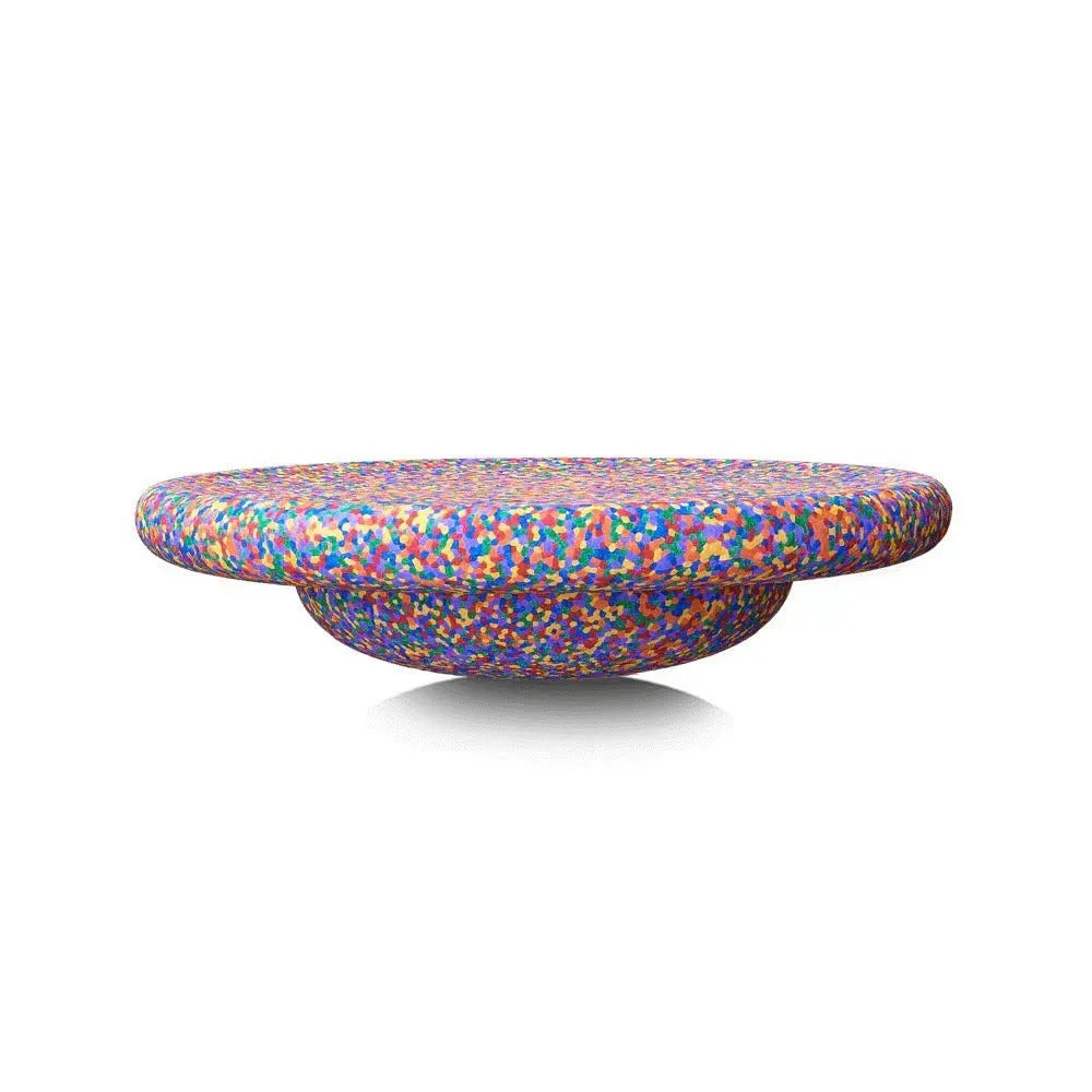 A plastic balance board for children, shown in mixed wood colour and solid black options.