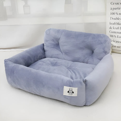 Grey and blue plaid cloth dog travel nest for use in a car, shown in two size options.