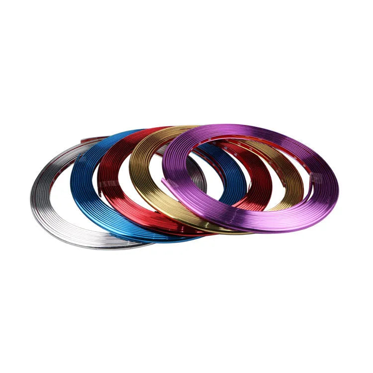 Roll of electroplated purple PVC wheel hub trim strip, 8 metres long, for car decoration and protection.