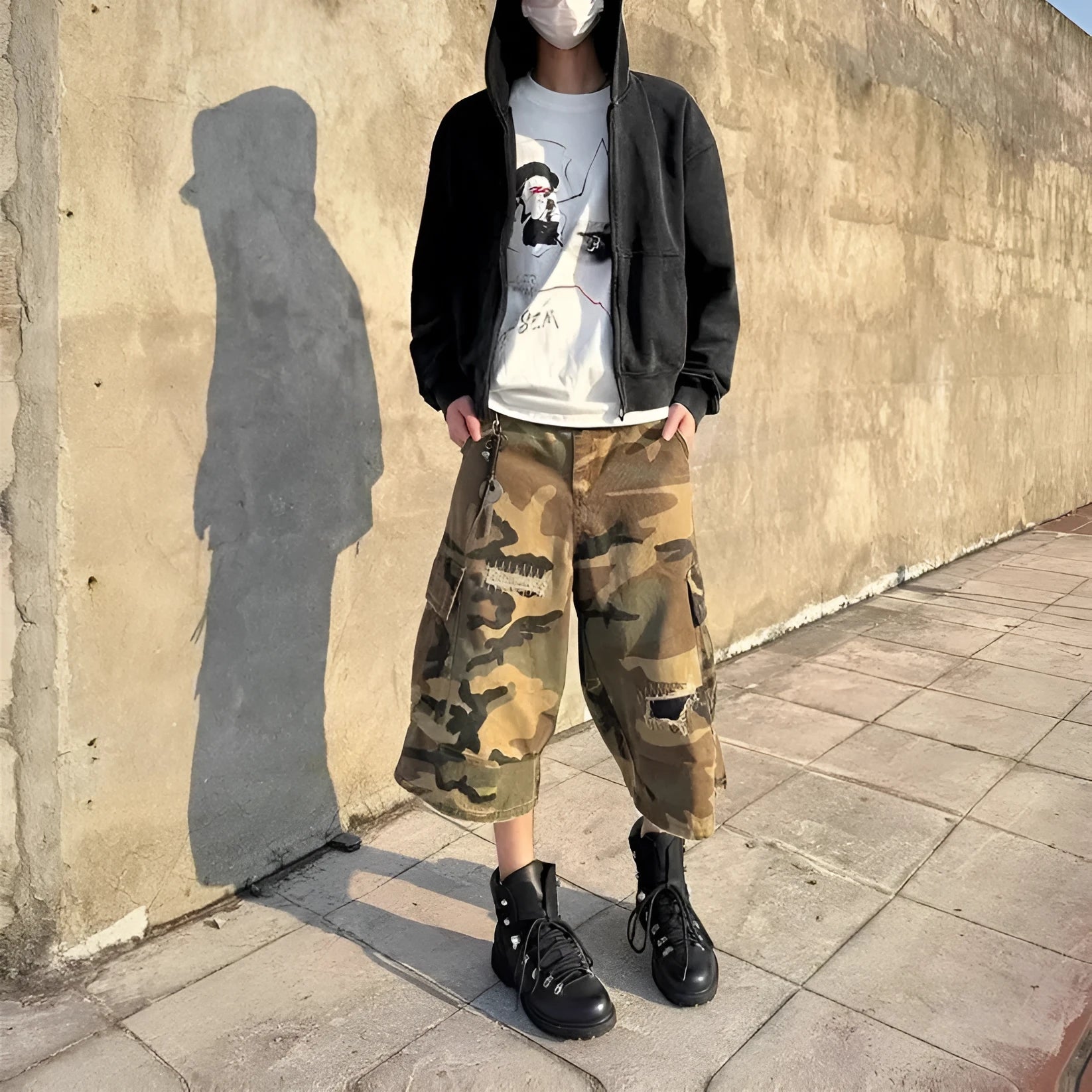 Men's camouflage pattern cropped jeans with distressed patches and straight leg cut