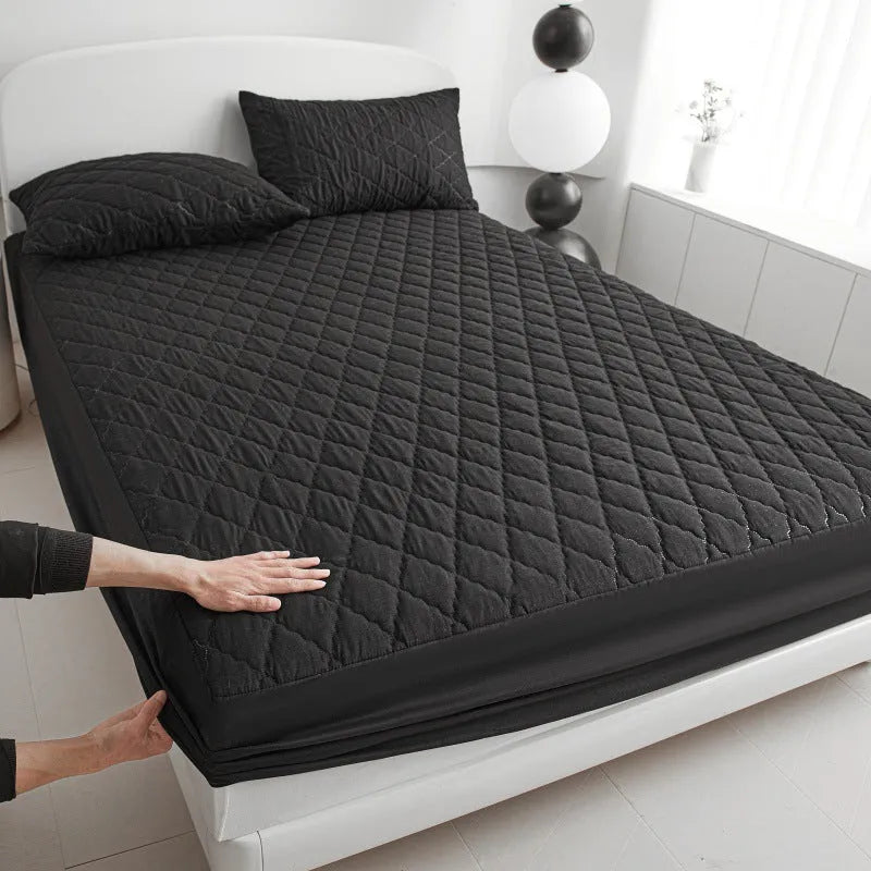 Diamond lattice quilted waterproof mattress protector set with bamboo fibre fitted sheet and pillowcases.