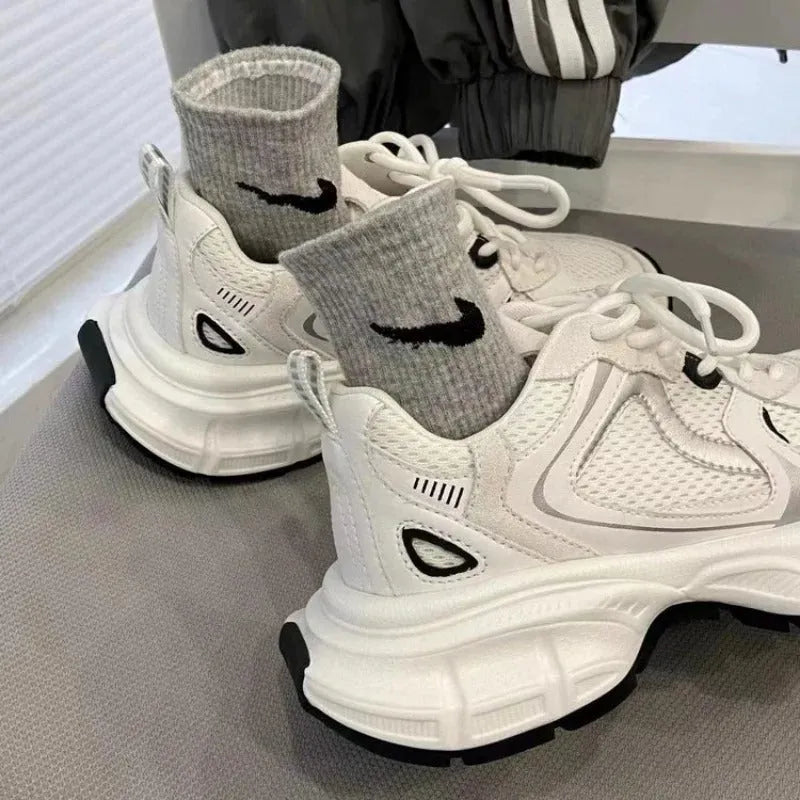 Beige mesh platform sports shoes with wedge muffin heel and lace-up front.