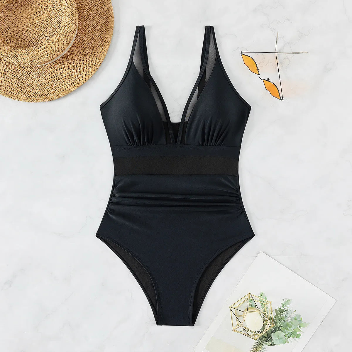 Black women's one-piece swimsuit with halter neck and mesh detail