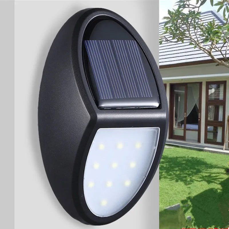 Black solar-powered LED wall light with automatic sensor measuring 75mm by 120mm