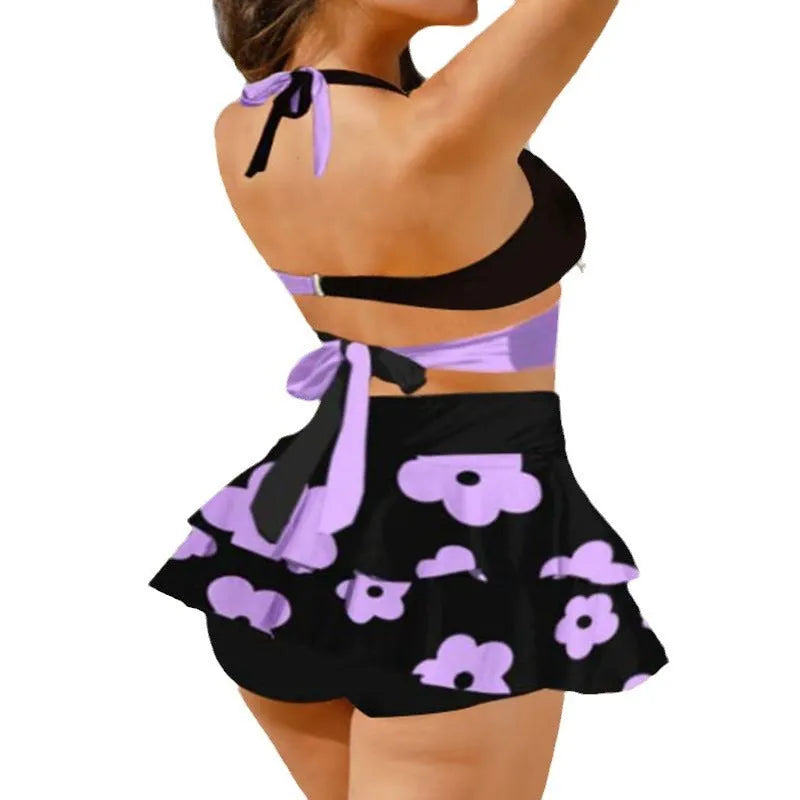 Women's purple lace-up backless bikini set with high-waisted skirt for swimming