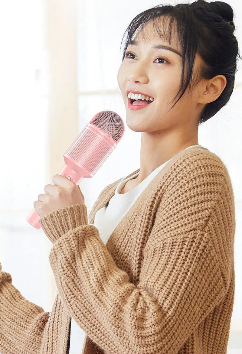 A wireless Bluetooth karaoke microphone shown in three colour options: girly pink, sapphire blue, and mint green.