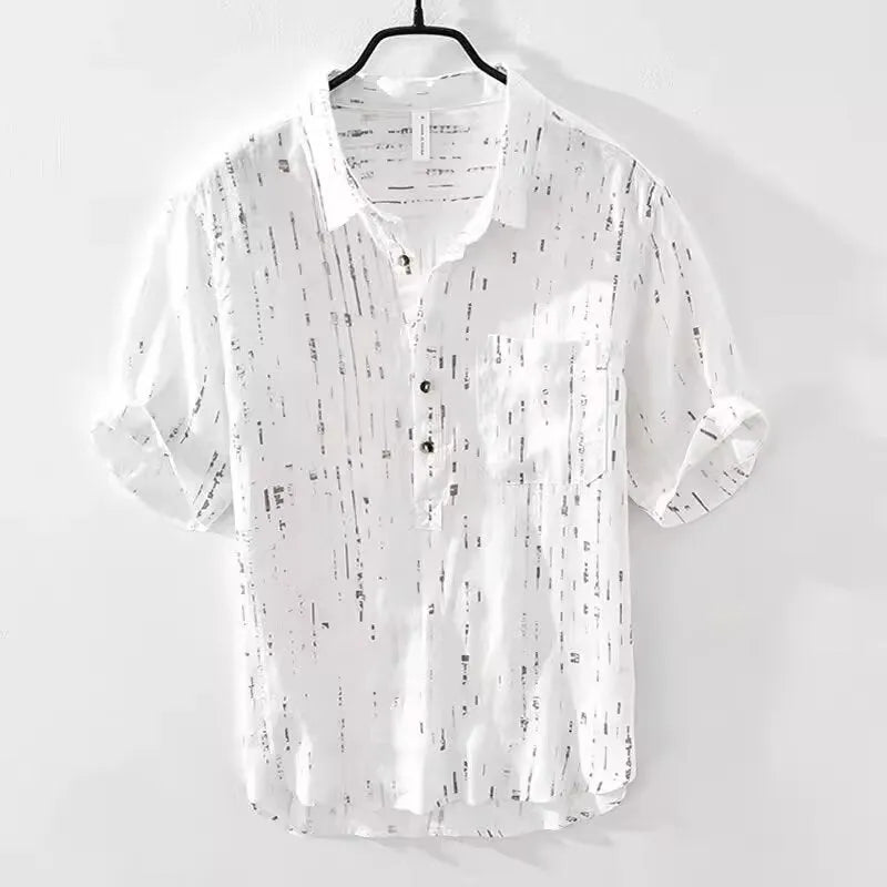 A man's loose-fitting black lapel polo shirt with short sleeves on a hanger.