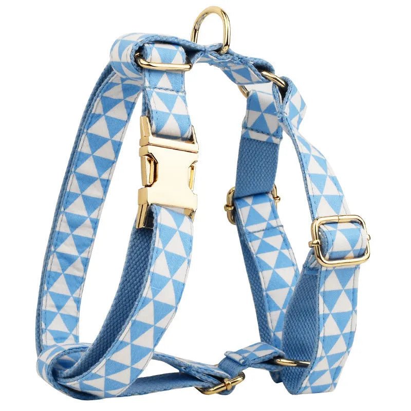 Blue triangular pattern dog harness set with matching leash, collar, and fabric bow accessory
