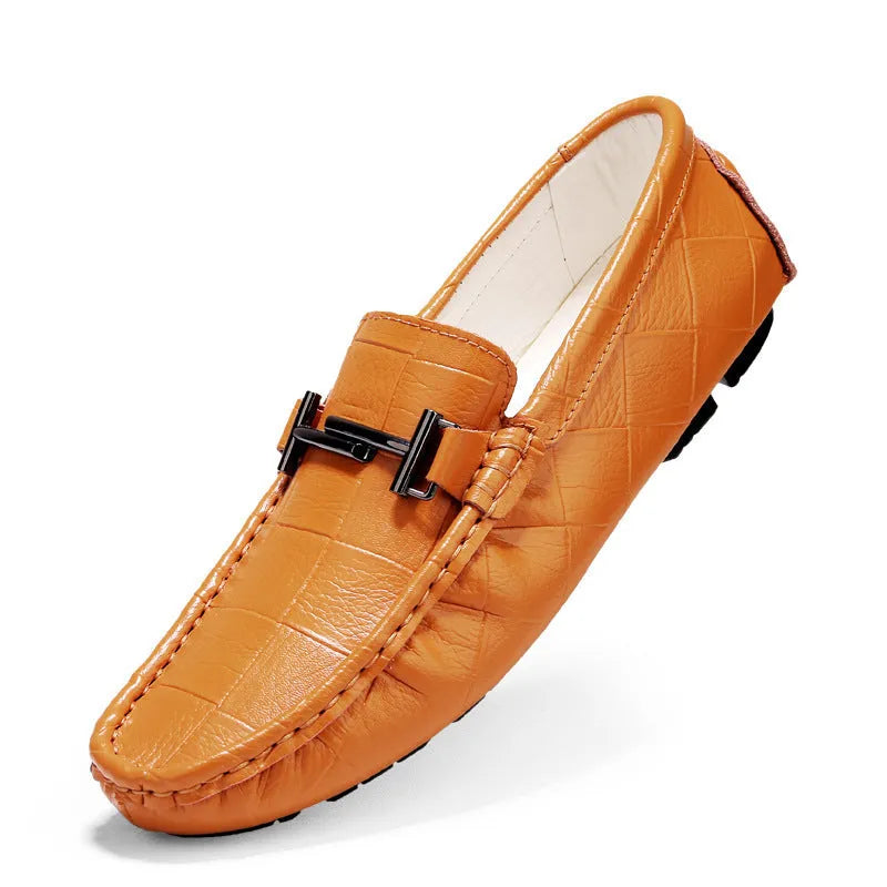 Men's black leather casual peas shoes with a belt buckle and flat rubber sole.
