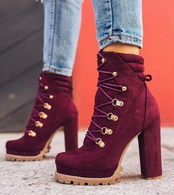 Women's suede ankle boots with a thick high heel and platform sole in four colour choices.