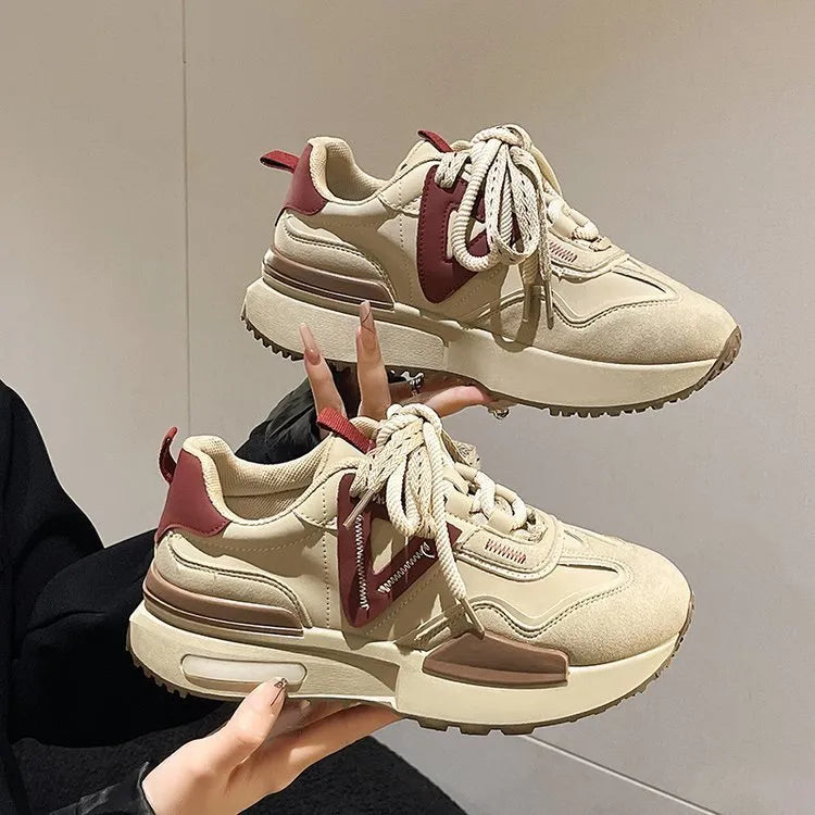 Women's black retro platform sports shoes with round toe and lace-up design on a white background.