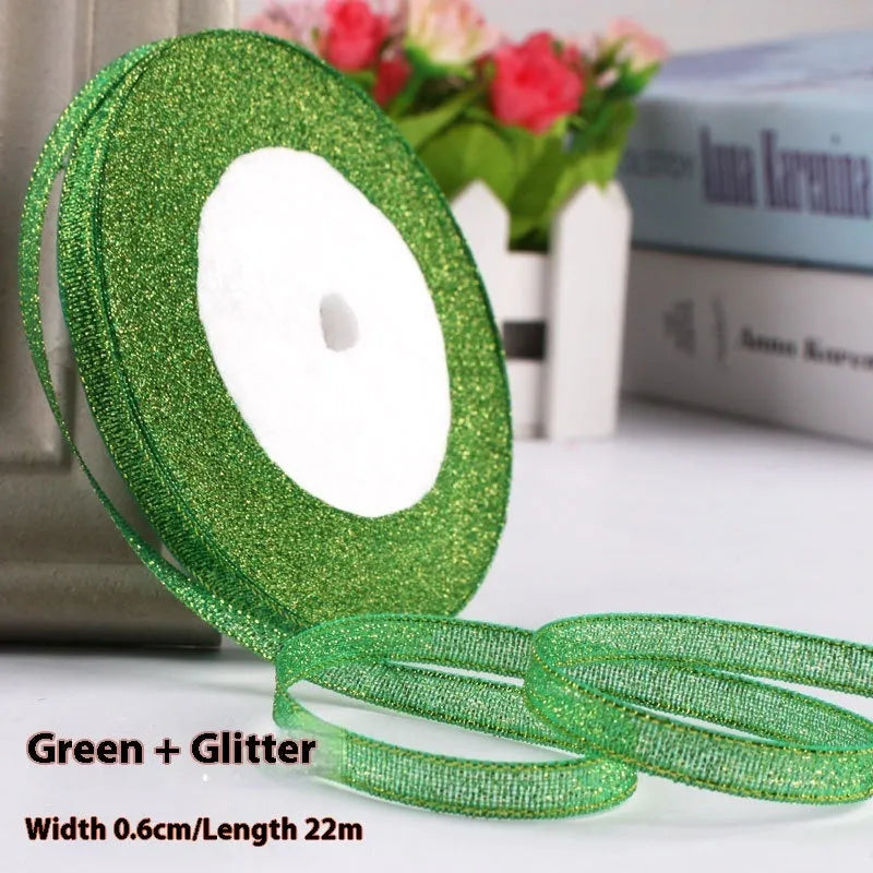 Roll of polyester gift ribbon showing 0.6cm width and multiple colour options including metallic finishes