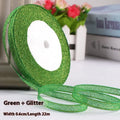 Roll of polyester gift ribbon showing 0.6cm width and multiple colour options including metallic finishes