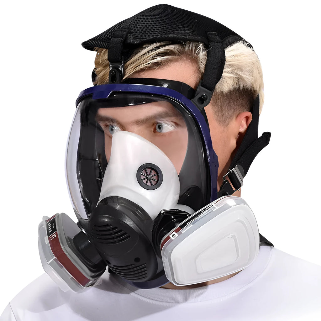 Blue-edged spherical full-face gas mask with a trapezoidal filter canister on a white background.