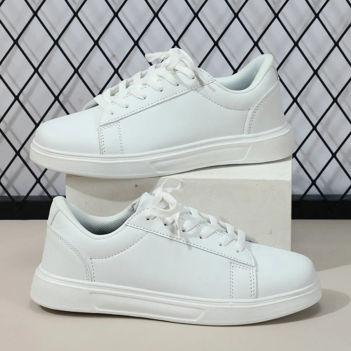Low-top platform skate shoes with cross-strap detail and mid-heel design in beige brown colour