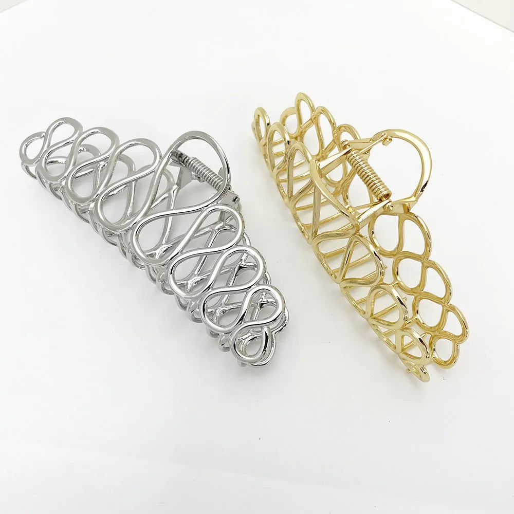 Large alloy hair clip with tassel design in gold electroplated finish for women's updo styling