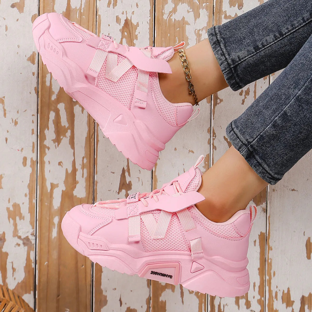 Women's purple platform mesh sports shoe with lace-up front and thick sole for height increase.
