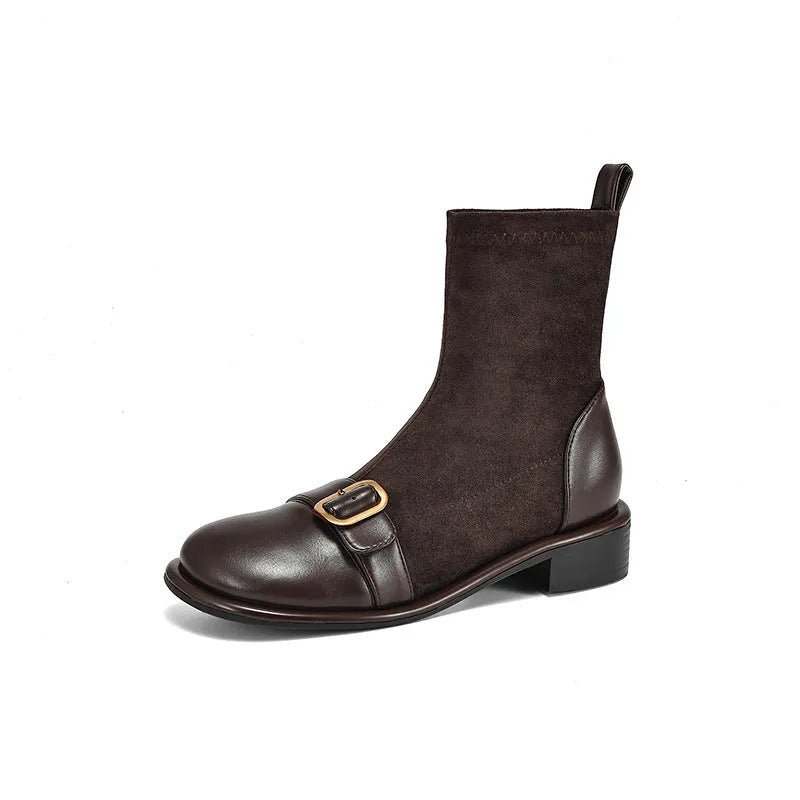 Women's black casual Martin ankle boots with lace-up front and buckle stitching detail on a low heel.