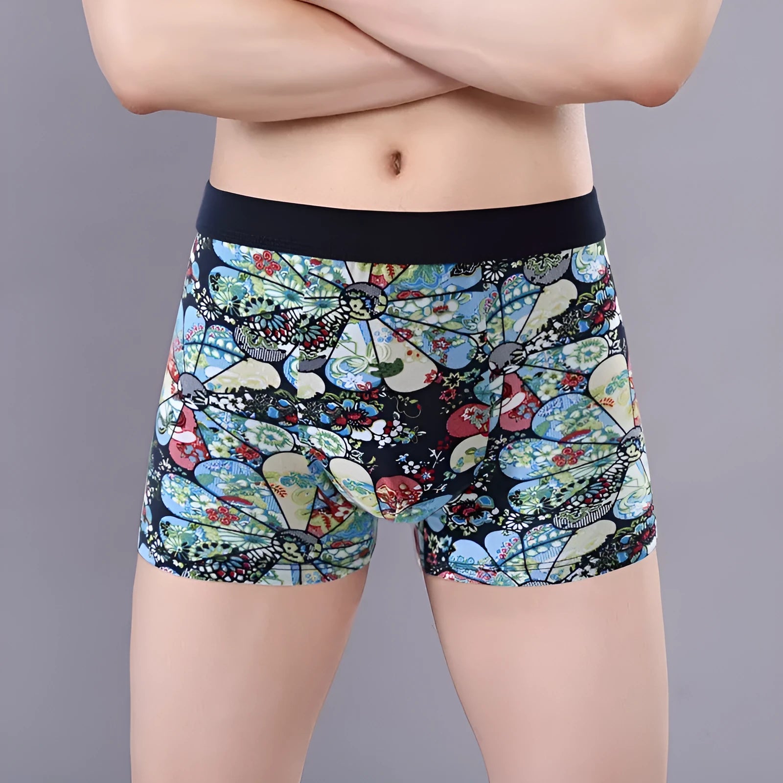 Men's cotton boxer shorts in a floral pattern, showing the mid-waist fit and U-shaped convex design.
