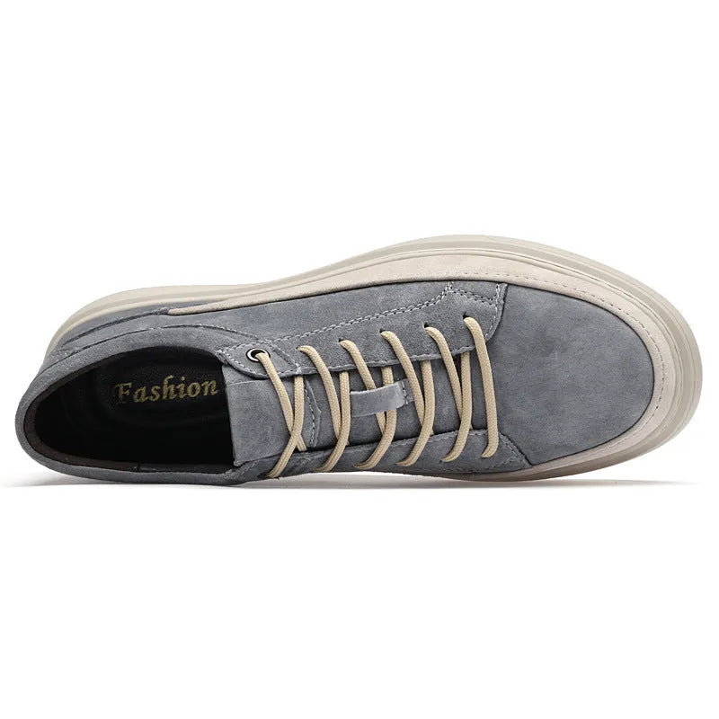 Men's gray casual skate shoes with pigskin leather upper and rubber sole on a white background.