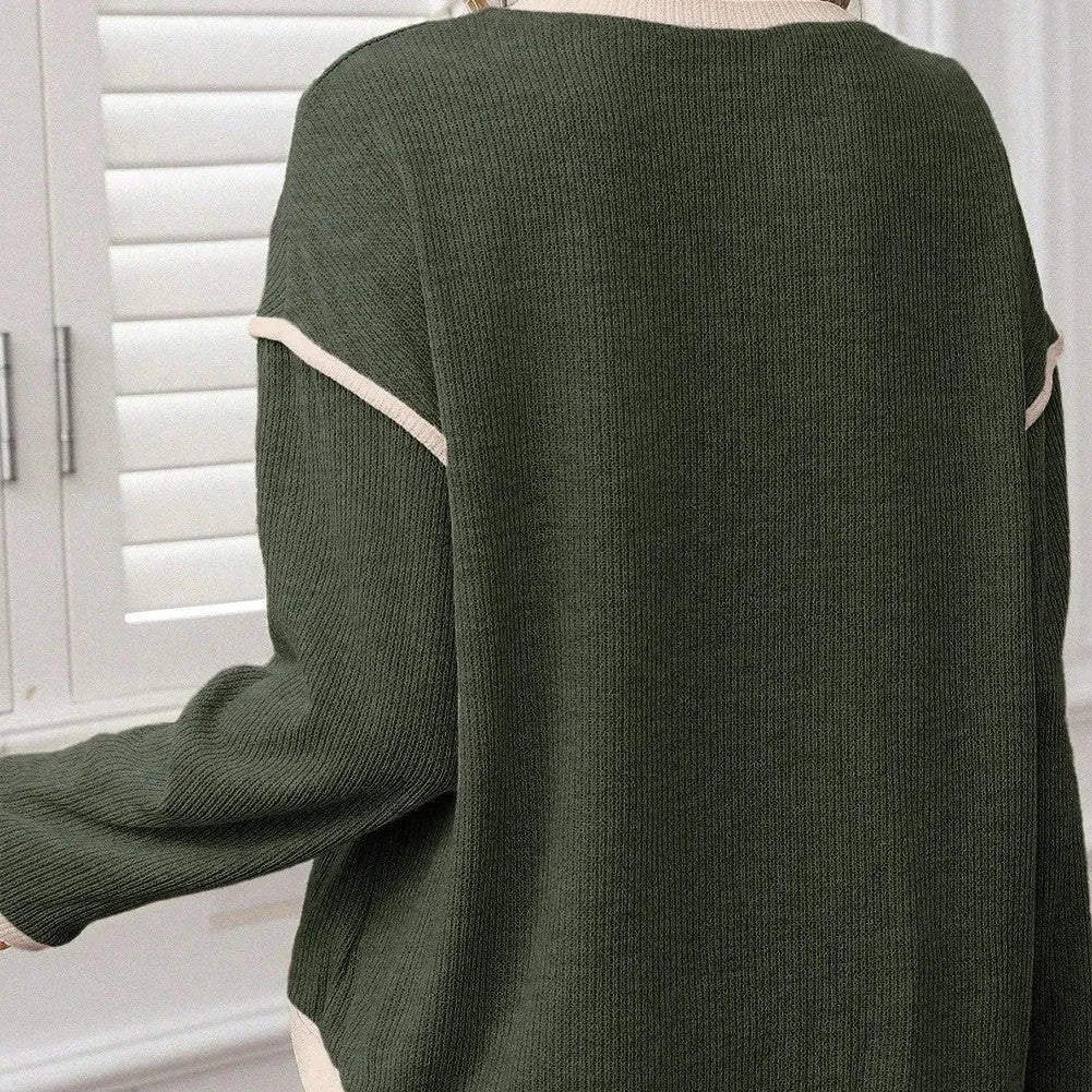 Women's beige knit top with four leaf clover pattern, contrast trim, and drop shoulder loose fit