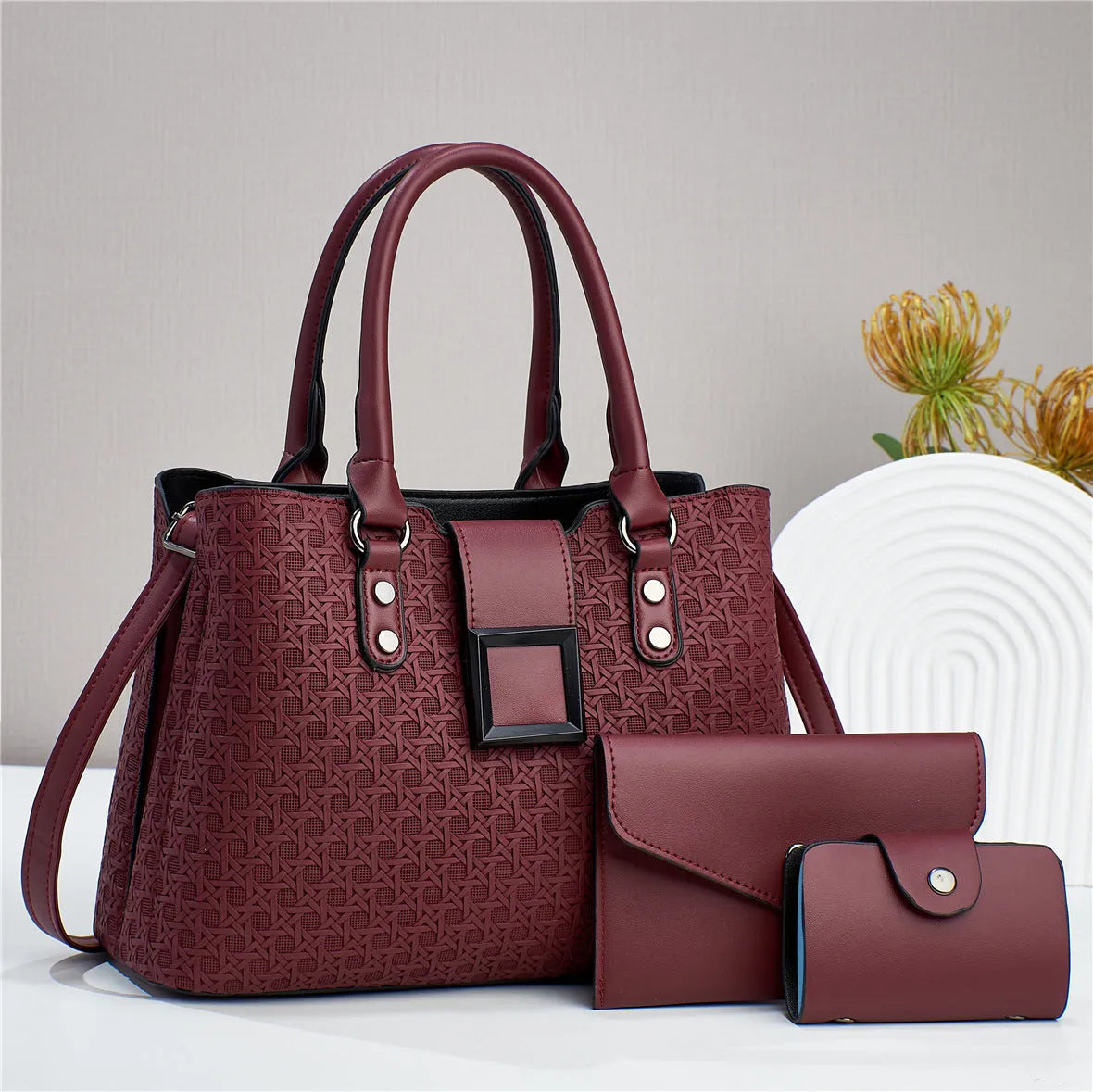 Three-piece women's crossbody bag in textured PU with square shape and open pocket
