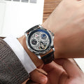 Men's automatic watch with luminous hands on a steel bracelet, black dial, and waterproof case.