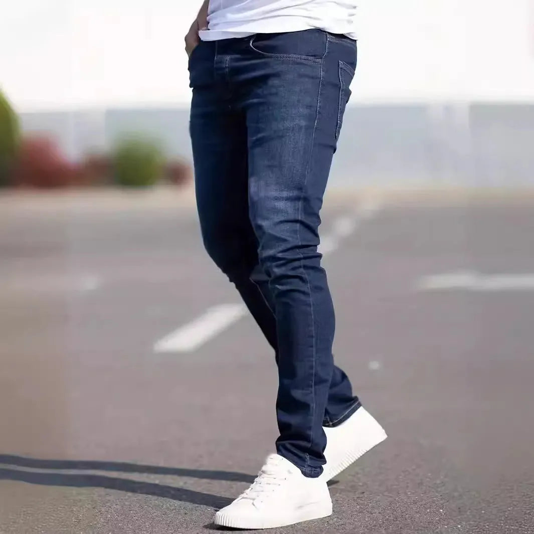 Men's dark blue slim fit casual jeans with skinny leg opening and mid waist
