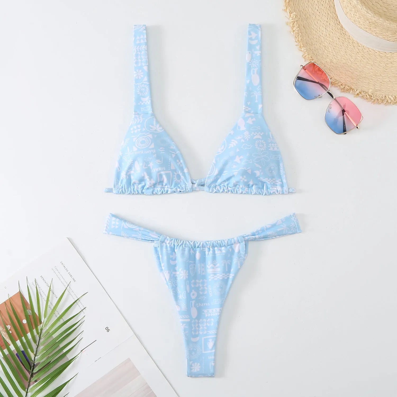 Women's floral printed bikini swimsuit two-piece set in blue on a mannequin.
