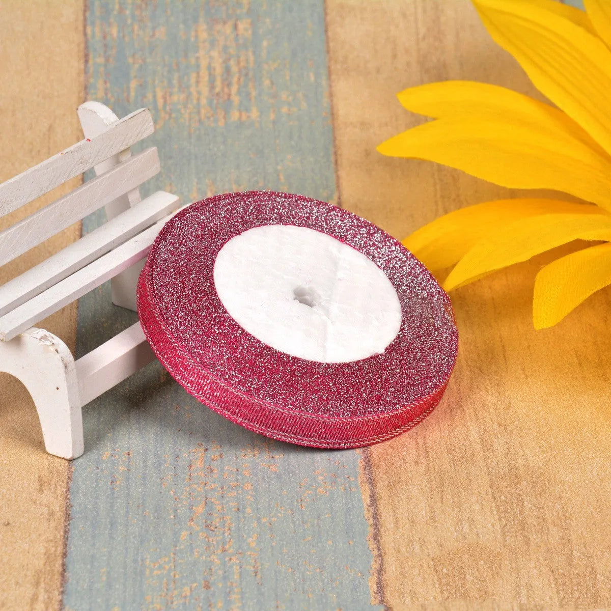 Polyester ribbon spool in metallic colours for decorative clothing and gift packaging trim