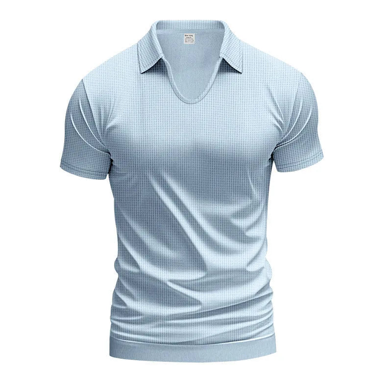 Man wearing a loose-fit apricot coloured V-neck short sleeve cotton blend T-shirt.