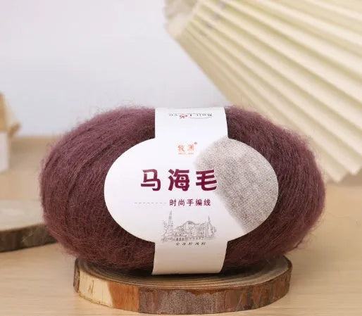Single ball of mohair yarn in various colours for hand-woven DIY scarf knitting projects