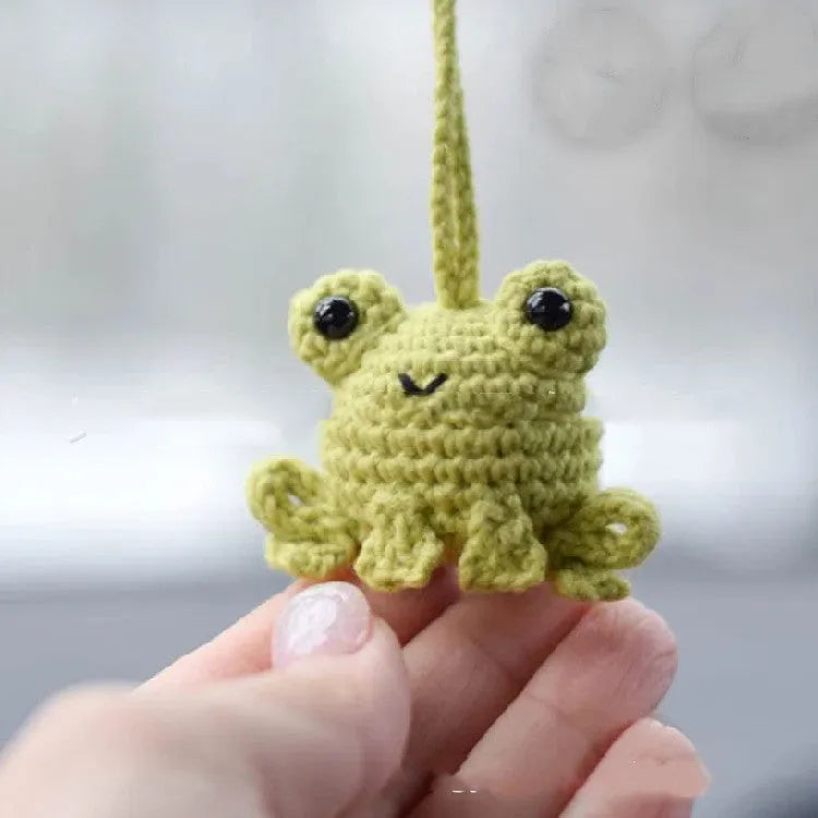Handmade woven plush frog car pendant measuring 5cm wide by 5cm high by 15cm long