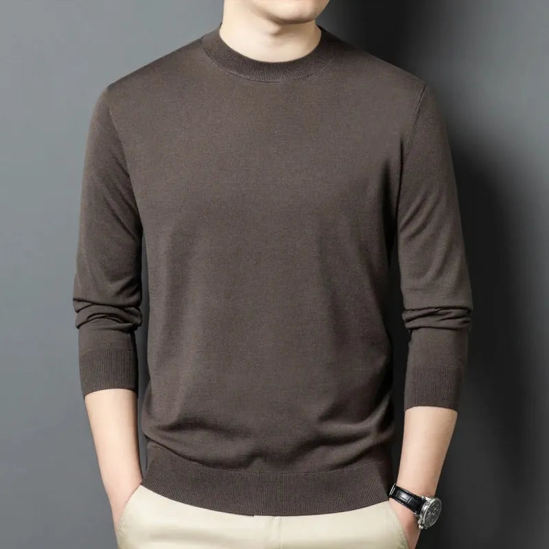 Men's round neck grey wool blend pullover sweater with long sleeves on a hanger.