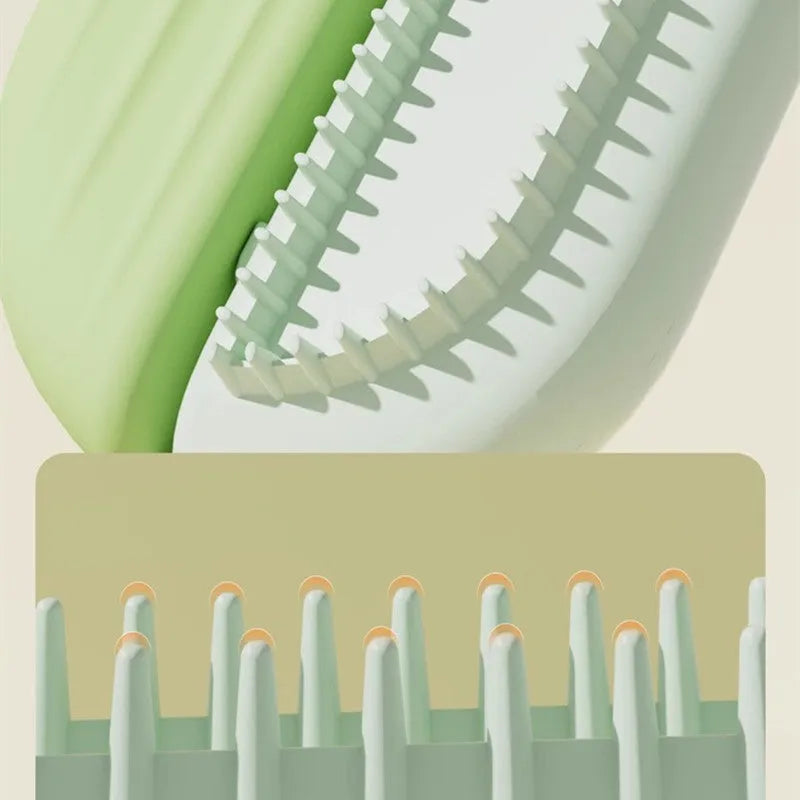 Blue pet grooming comb with water tank for removing hair and detangling knots on dogs and cats.