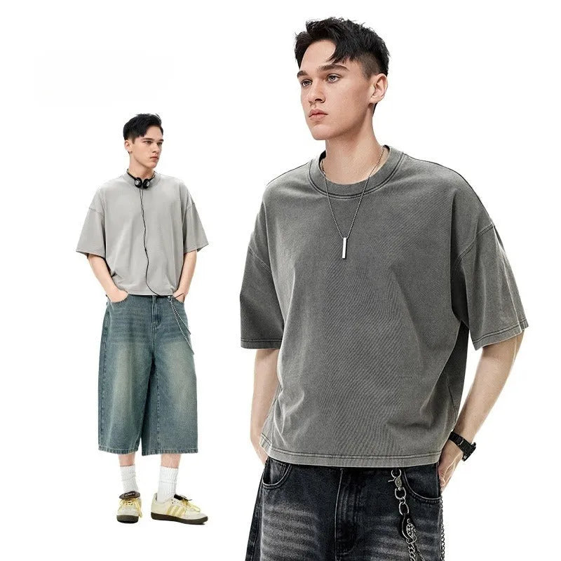 Men's vintage cotton t-shirt with washed-out treatment in khaki light colour showing loose fit and drop-shoulder sleeves